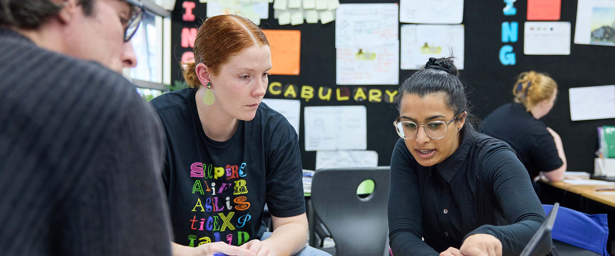 Laptop displaying the Be You Get Started home page during a planning meeting.