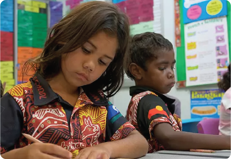Two children working in a classroom
