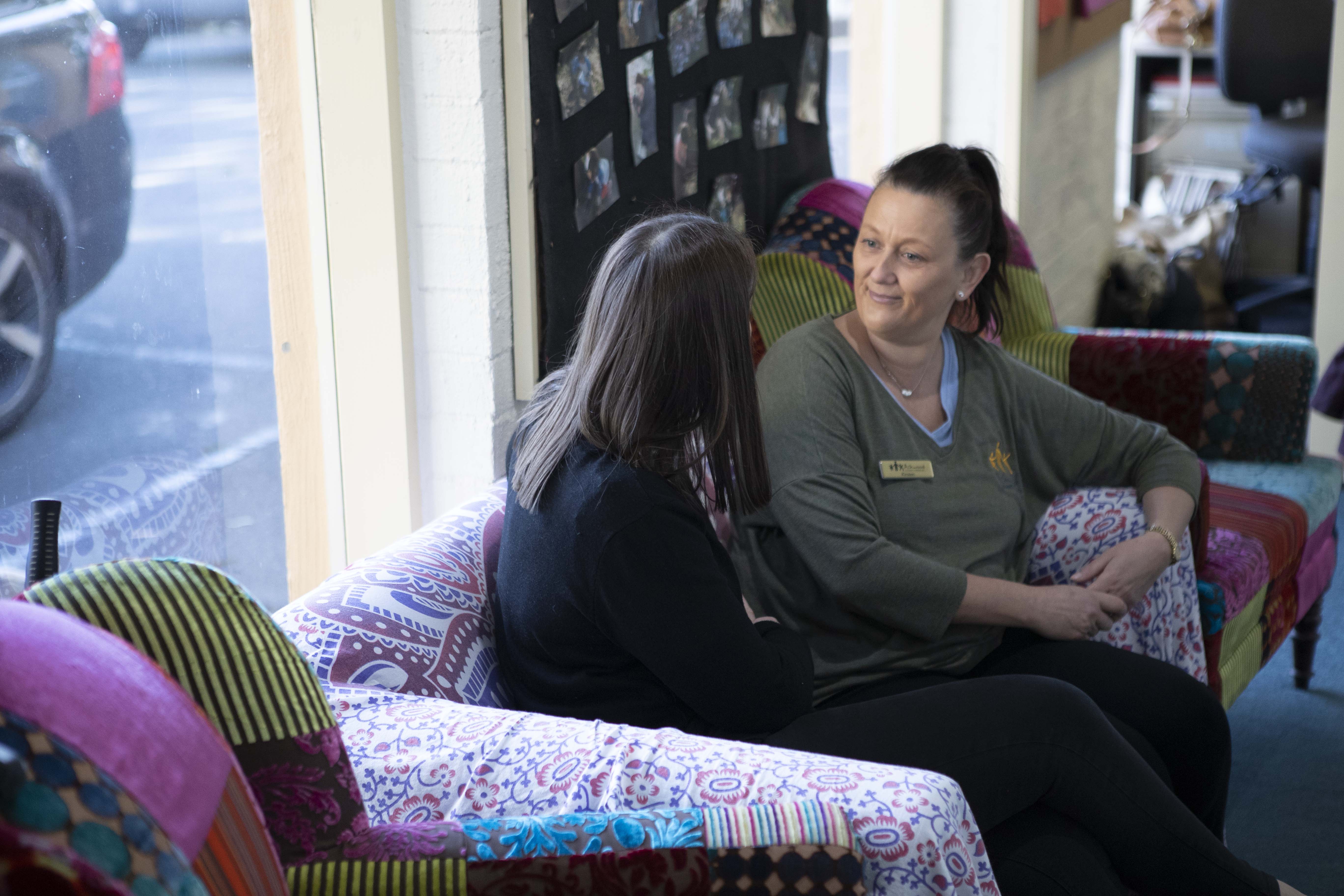Two educators engaged in conversation