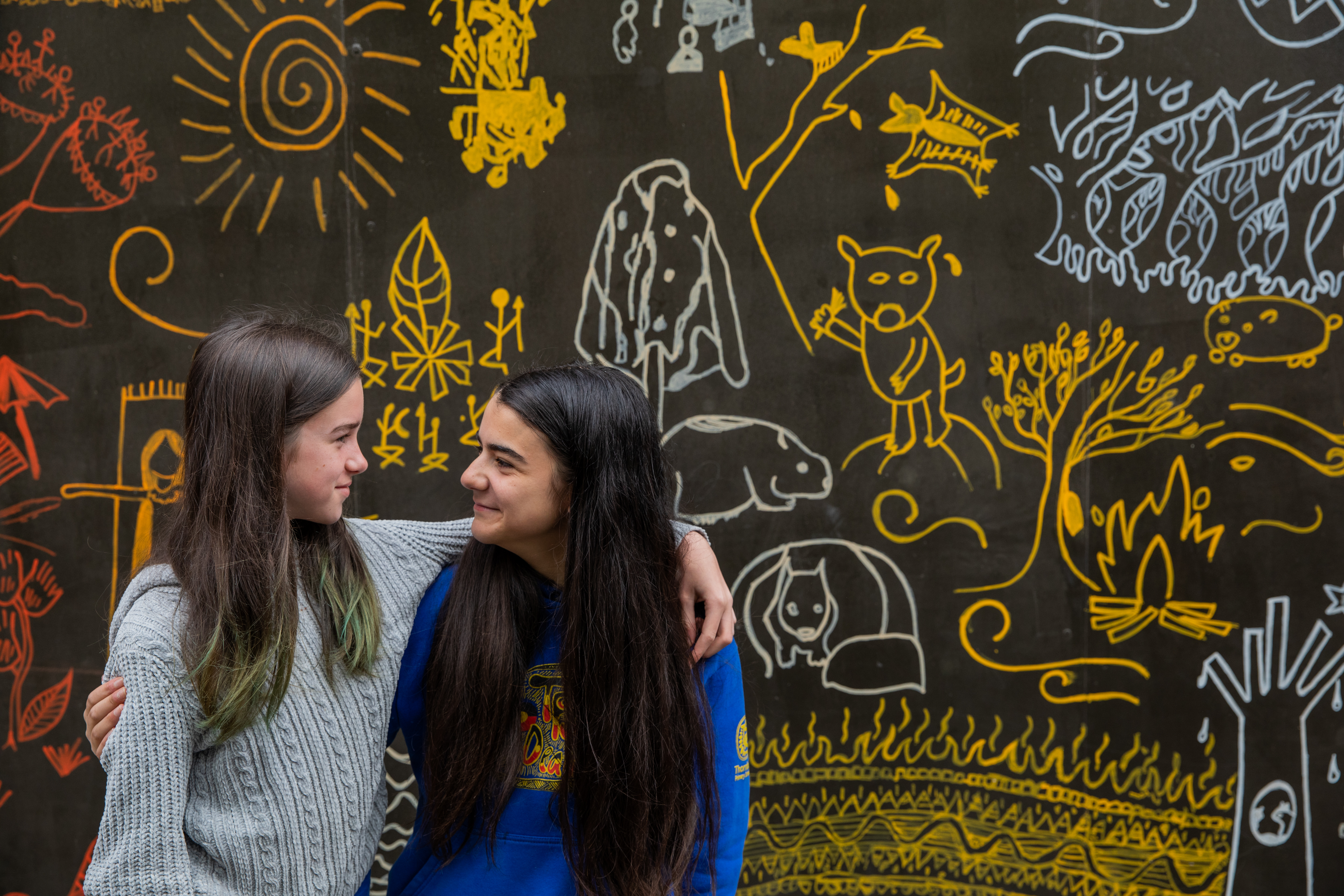 Two students hugging